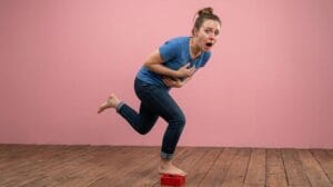 a woman step foot on a lego brick